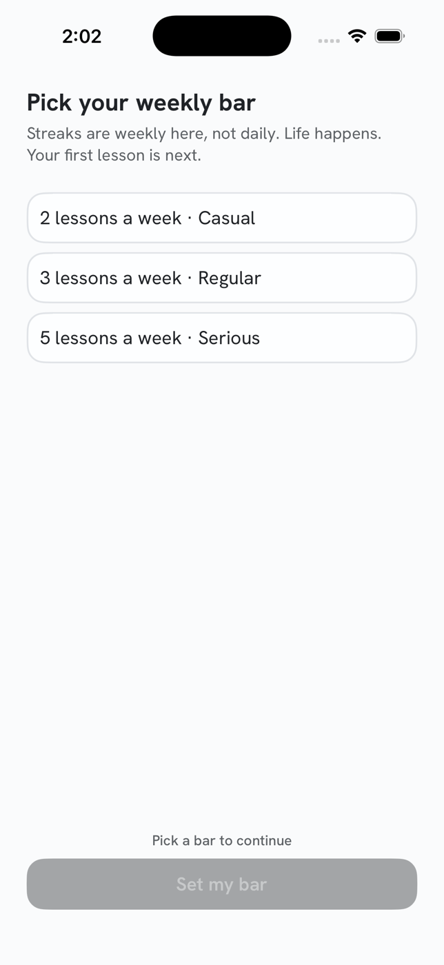 Setting a weekly goal in the Unscary AI app: “Pick your weekly bar”, with the note “Streaks are weekly here, not daily. Life happens.” and three options: 2 lessons a week (Casual), 3 (Regular), or 5 (Serious).